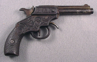 iron from of cap pistol had ornate vine and leaf pattern